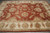 9'8" x 13'10" Indian Agra rug shown at angle with floral field and ivory border