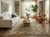 Living room styled with light blue Oushak wool rug, cream sofa, leather armchair and oak coffee table