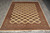 6'11 x 8'5 Bokhara Oriental rug displayed on grey tile floor with ivory fringe ends