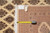 Back of the rug with hand woven tag and tape measure showing knot density detail