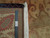 Back of the rug with ruler, authentic hand knotted tag and ivory cotton fringe