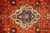 Close up of the ivory and blue lobed medallion with its 8 petal rosette center