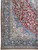 Corner detail showing indigo floral border, blue spandrel and dense vine work on wool pile