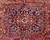 Detail of the 8 lobed navy medallion with floral sprays outlined in light blue