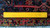 Back of the hand-knotted wool pile with ruler and white cotton fringe showing knot density