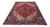 Angled floor display of red and navy Heriz rug showing stepped medallion and ivory corners
