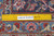 Ruler on 8'8" x 12'6" Kashan rug showing hand-knotted wool weave and knot density