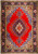 Full flat view of red Sarouk rug with navy blue medallion, ivory spandrels and floral border