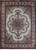 Ivory field Persian Tabriz rug with rose and blue floral medallion and burgundy border