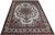 9'8" x 13'2" Persian Tabriz rug photographed at an angle, ivory field with burgundy borders