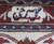 Woven signature cartouche in the burgundy border confirming this signed Persian Tabriz workshop rug