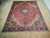 9'9" x 13'2" Tabriz rug laid full length on hardwood floor showing overall medallion layout