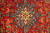 Close-up of ivory and navy 8 point medallion surrounded by scrolling Shah Abbasi palmettes