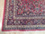 Corner detail showing navy spandrel, palmette border cartouches and crossed X minor stripe