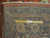 Back of the rug with ruler measuring knots per square inch on cotton foundation