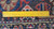 Back of the Heriz showing evenly tied wool knots measured against a yellow ruler