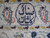 Woven cartouche signature in navy Persian script at the border of this signed Kashan rug
