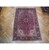 6'8" x 10'3" Persian Heriz area rug shown full length on wood parquet flooring