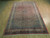 6'7" x 10' Bijar rug displayed on light oak flooring showing full coral field and ivory borders