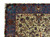 Corner detail of the blue border, large paisley boteh motifs meeting the ivory floral field