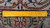 Back of the Persian Tabriz rug with a ruler laid across the weave to gauge knot count