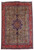 Olive green Persian Tabriz rug with navy star medallion and red floral main border, overhead view