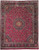 Burgundy Persian Mashad rug with ivory star medallion, navy boteh border and dense floral vine field