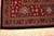 Corner border detail with red ground, turquoise palmettes, guard stripes and hand-tied ivory fringe