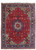 Full overhead view of red Persian Tabriz rug with ivory medallion and navy floral border