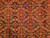 Close-up of hand-knotted Herati field with rosettes, curved leaves and coral gold accents