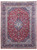 Overhead view of red Persian Kashan rug with navy floral border and ivory center medallion