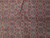 Close-up of all over Herati fish pattern with rosettes in red, pale blue and olive