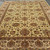 10 x 14 Persian rug seen at an angle, dense wool pile and taupe palmette border