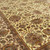 10 x 14 hand-knotted rug photographed on the diagonal, sage green and rust floral vinery across the field