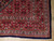 9'9" x 13' Persian Tabriz rug corner showing burgundy Herati border and navy selvage edge