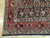 Corner detail showing red orange main border, ivory guard stripes and finely drawn Tabriz style florals
