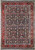Full overhead view of black field Persian Bijar rug with red orange floral border and ivory guards