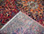 Back of the hand-knotted Bakhtiar rug showing dense wool knots, cotton foundation and original ivory fringe