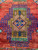 Single Kazak medallion with cobalt latch hook outline, camel ground and red diamond center