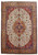 Full view of 8' x 12' Persian Tabriz rug with ivory field and salmon octagonal medallion
