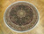 7 x 7 round Oriental rug displayed on parquet wood floor showing its full circular design