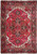 Red Persian Heriz rug with navy stepped medallion, ivory spandrels and floral geometric border