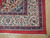 Corner detail of ivory main border, rose guard stripe and original white cotton fringe