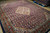 Angled view showing all over Herati fish pattern across the indigo field and salmon spandrels