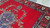 9'10" x 12'8" Persian Tabriz rug on concrete showing wool pile and flowering sprays
