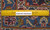 Reverse of the rug beside an 8 inch ruler showing tight hand-knotted wool weave