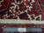Ruler against cotton fringe and reverse of rug confirming authentic hand-knotted Persian weave and knot density