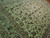Angled view showing the all over floral pattern and wide ivory main border detail