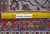 Back of the hand-knotted wool rug with ruler, showing knot density and Authentic Handmade label