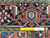 Ruler laid across the border showing authentic hand-knotted wool weave and knot density of this Heriz